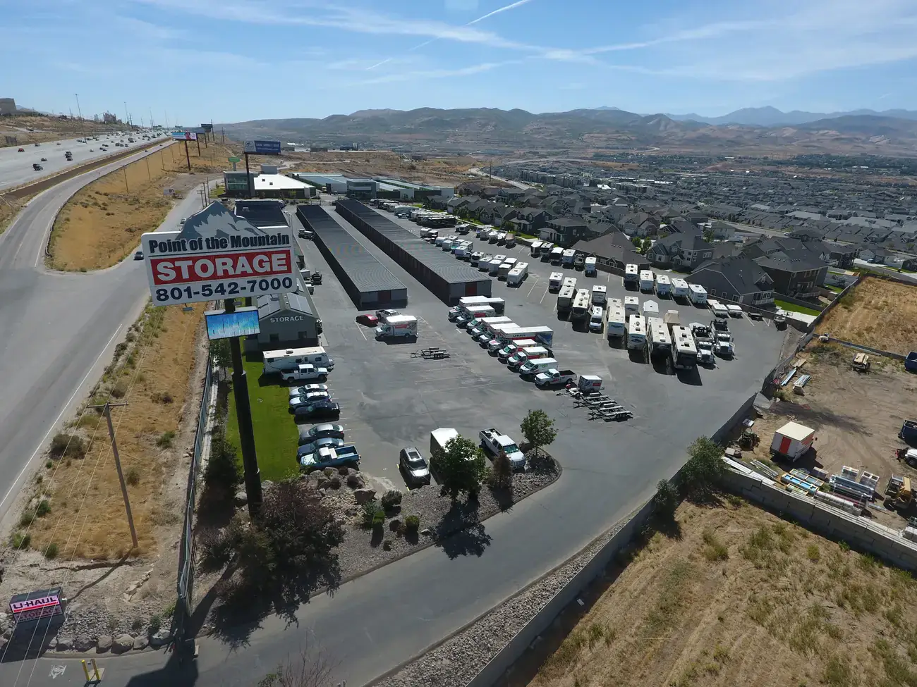 Boat and RV storage facility full of motorhomes and trailers off the highway